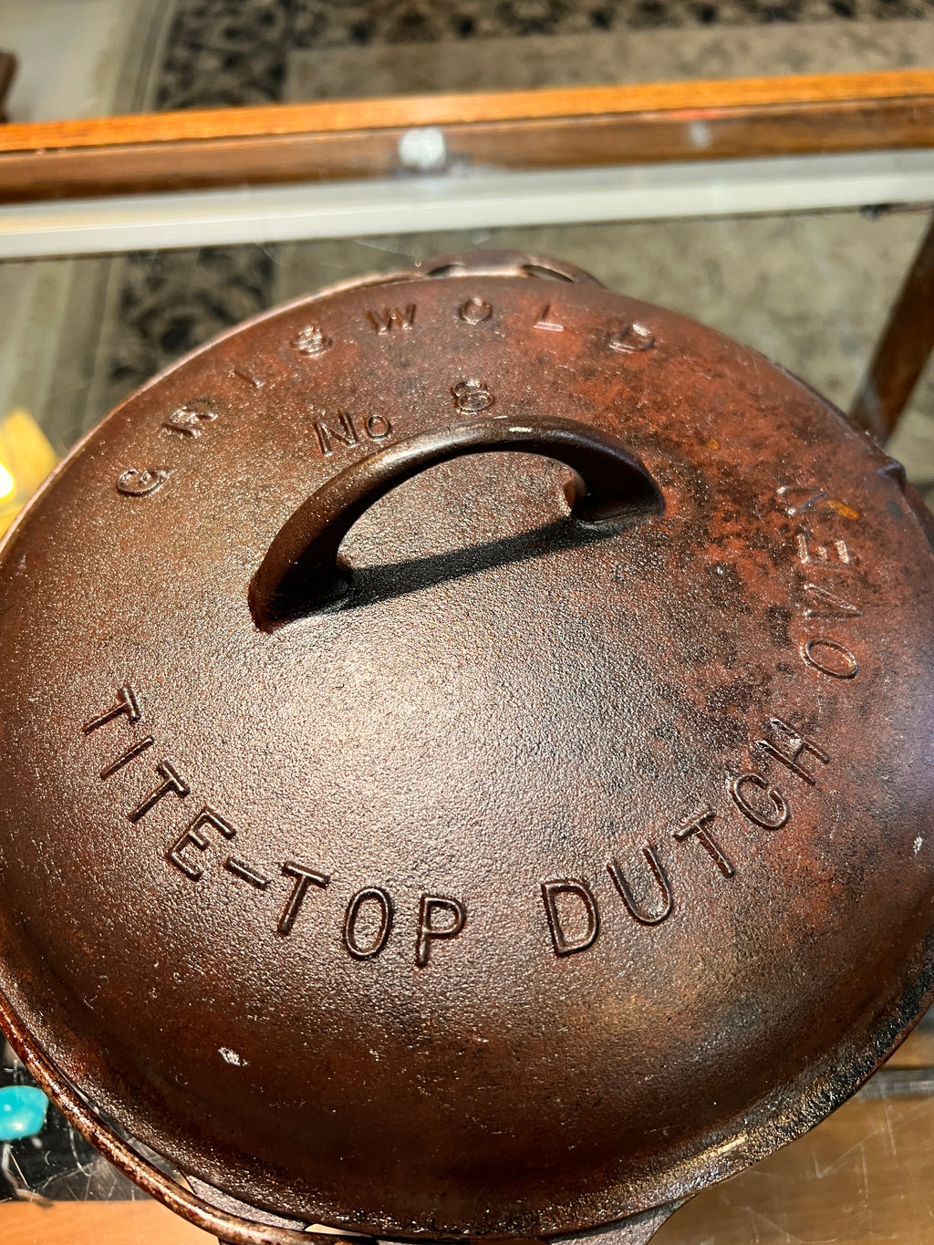 Close-up of a cast iron skillet with branding on a blurred background