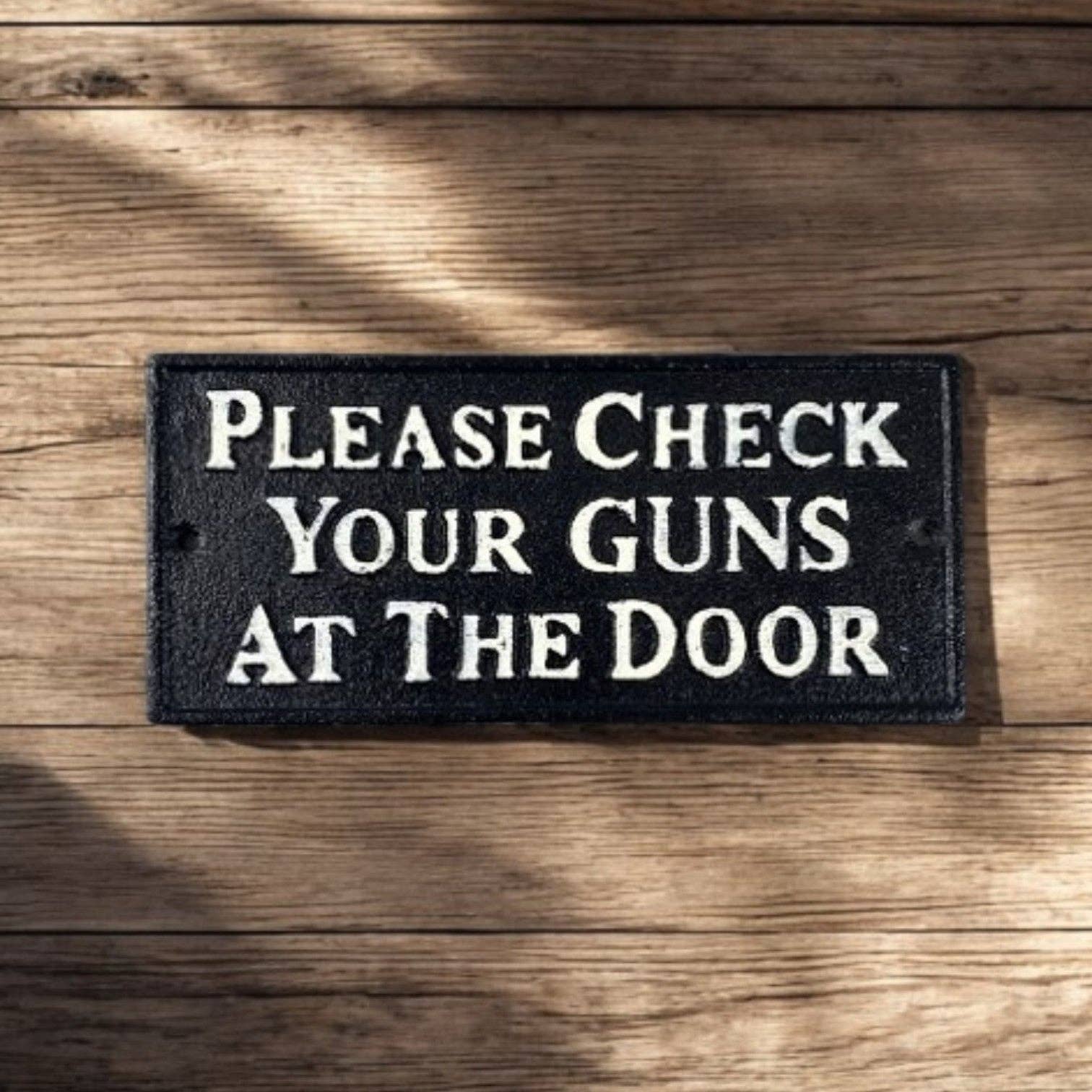 Rugged Cast Iron "Please Check Your Guns at the Door" Sign, Western Saloon Decor