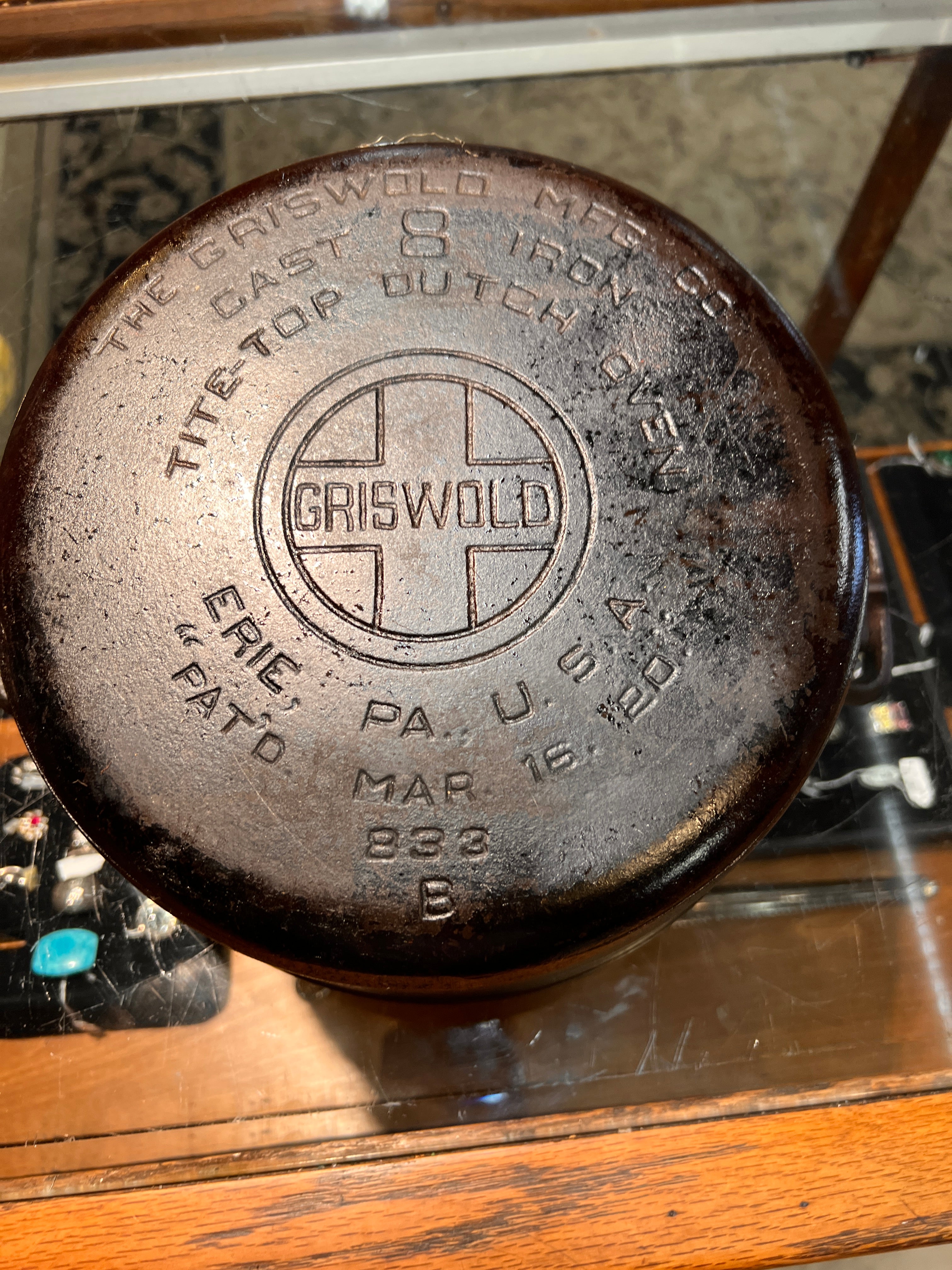 Vintage cast iron skillet with Griswold logo on a wooden surface