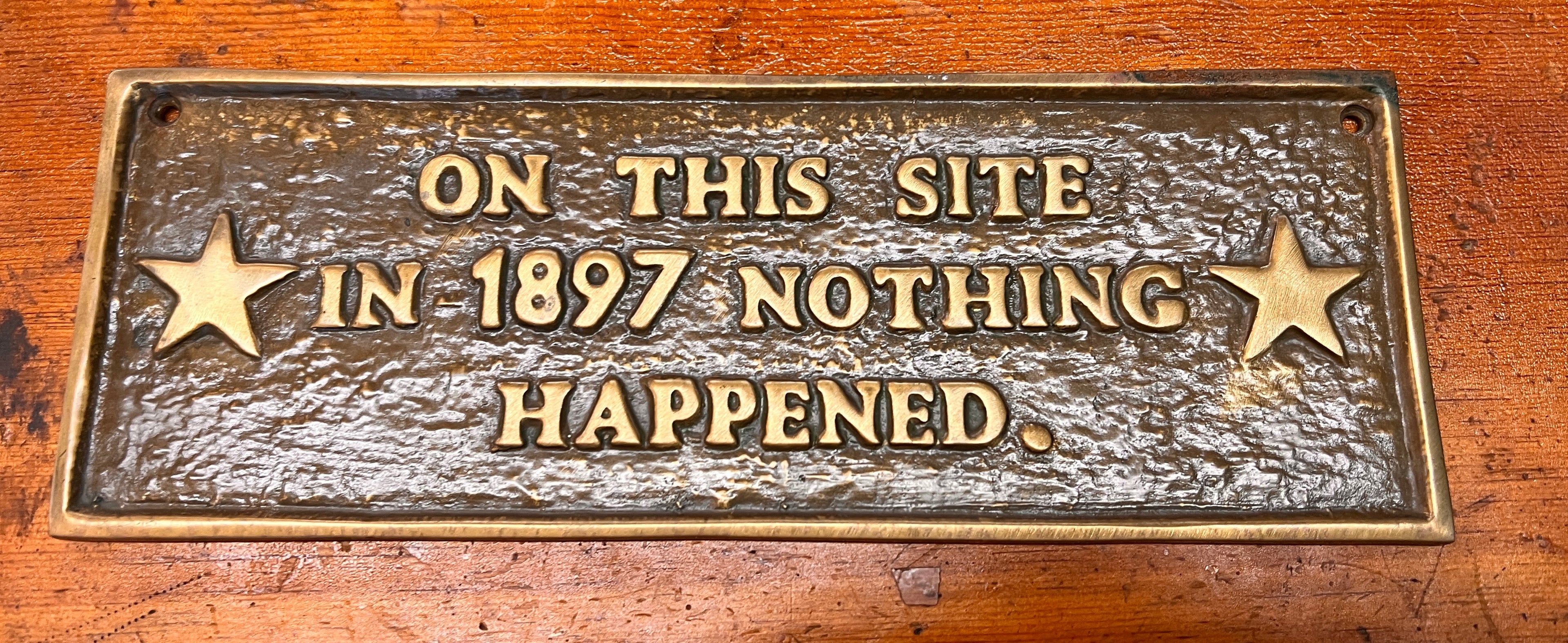 On This Site In 1897 Nothing Happened Cast Iron Plaque