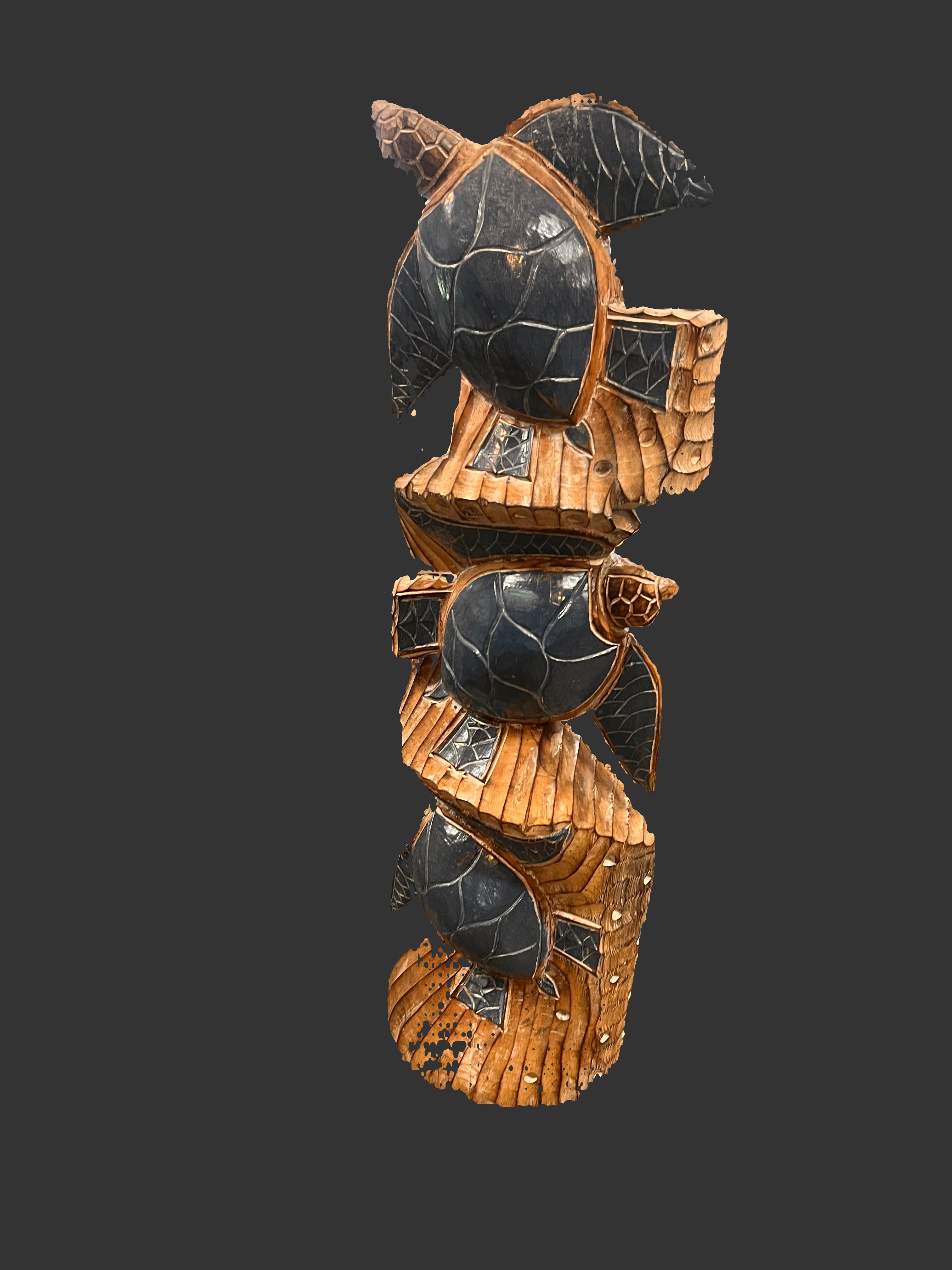 Decorative wall art with black and gold design on a patterned wall.